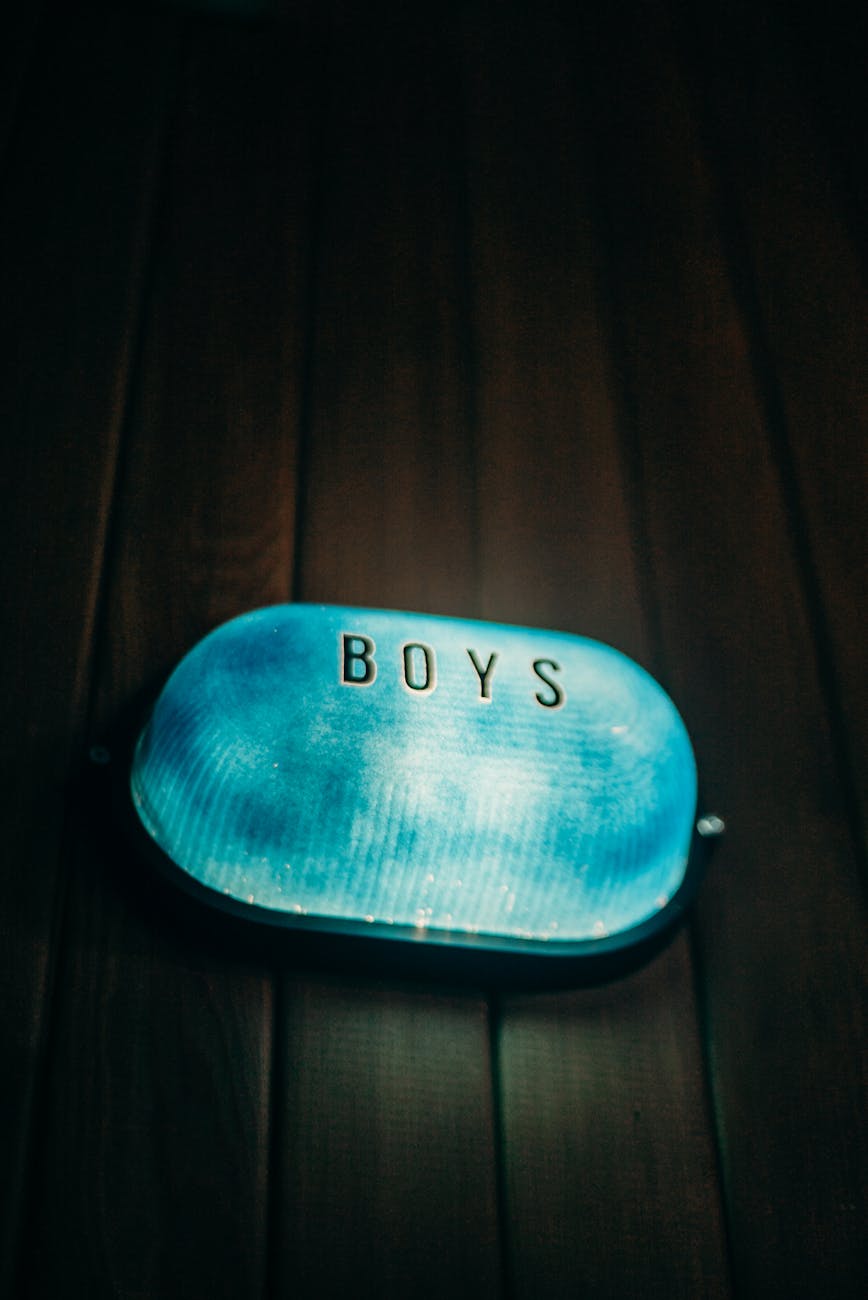 blue and white pouch on brown wooden table